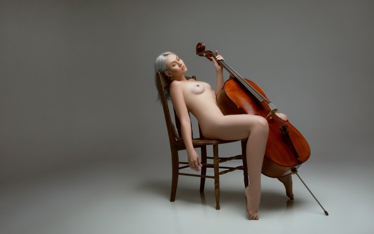 Naked women with musical instruments