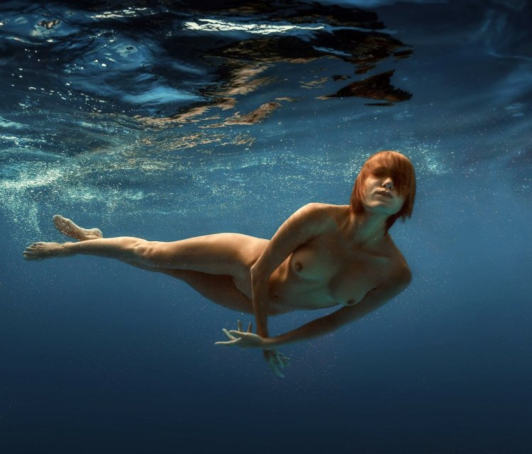Naked beauties underwater