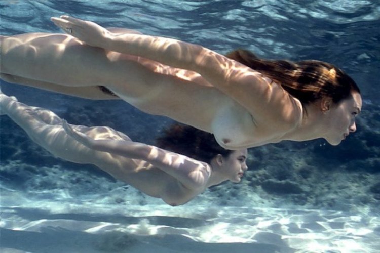 Naked beauties underwater