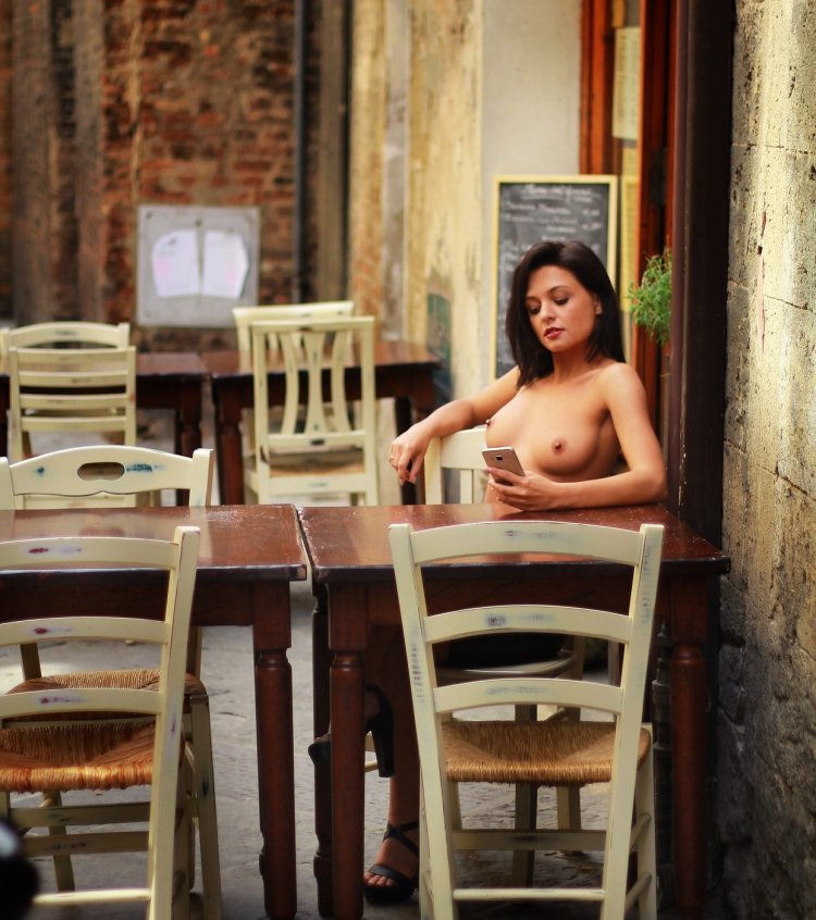 Girl naked in a cafe