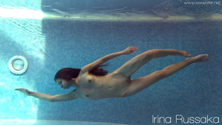 Naked pregnant woman under water