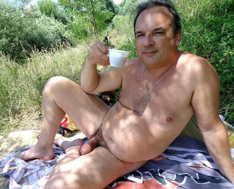 Naked elderly man in nature