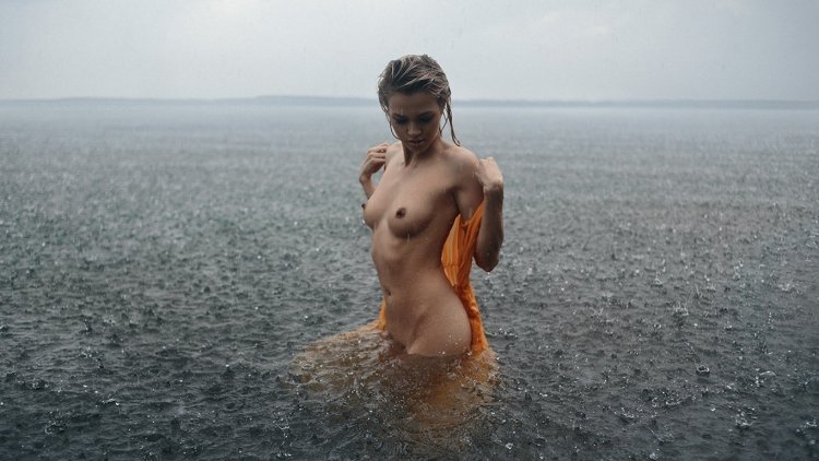 Girl naked in the rain