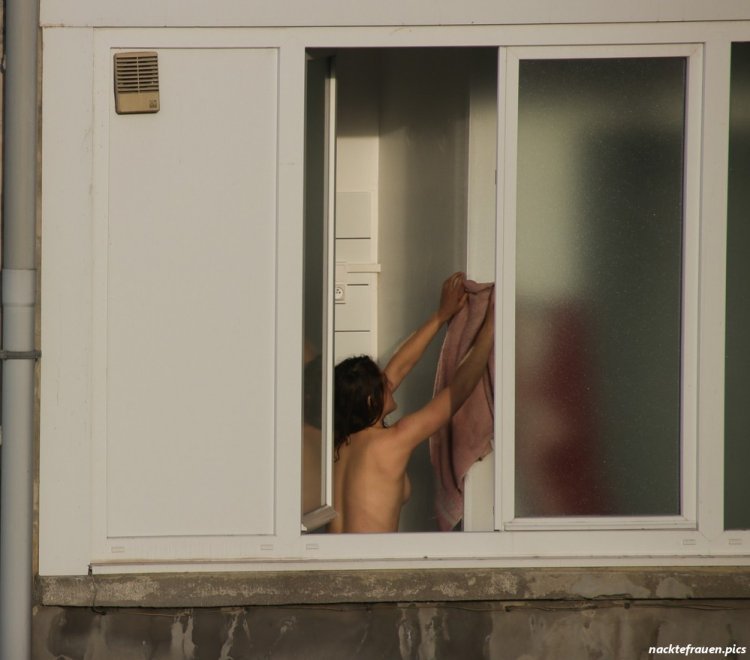 Naked in the window lit up