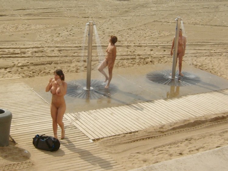 Nudist in the beach shower