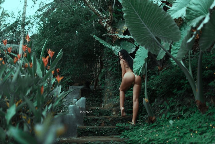Naked woman in a tropical forest