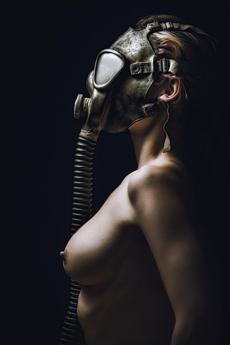 Naked woman in a gas mask