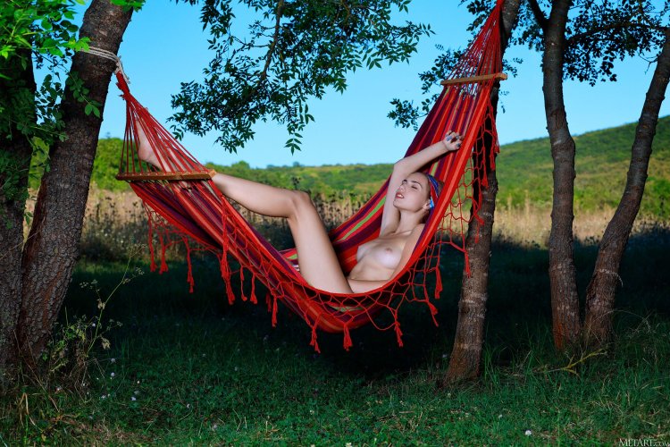 Girl with big tits in hammock