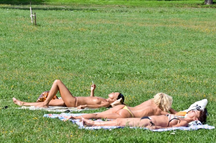 Girls sunbathing in parks