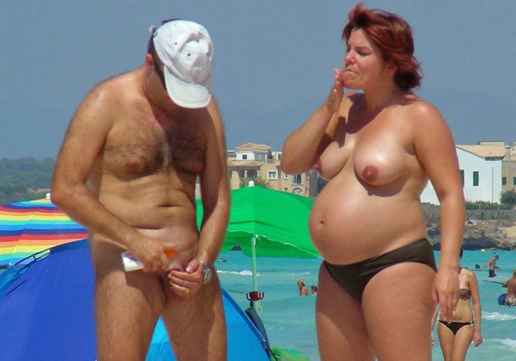 Pregnant nudists on the beach