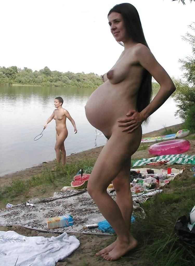 Naked pregnant woman in nature