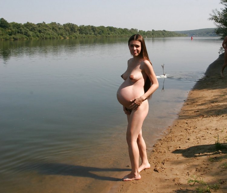 Pregnant naked on the river