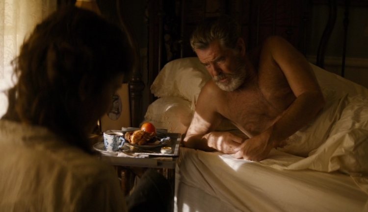 Pierce Brosnan sits goals