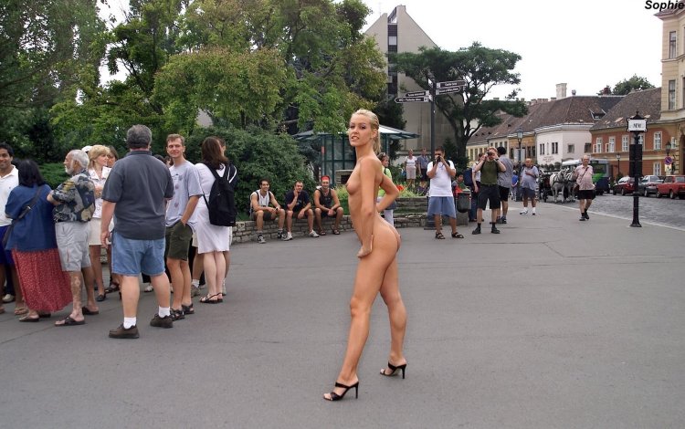 The girl undressed in the city center