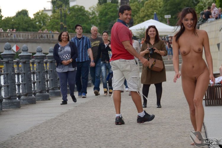Asian walks naked along the street