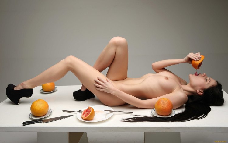 Naked woman at the table