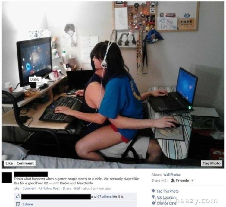 The guy is at the computer and the girl is on him