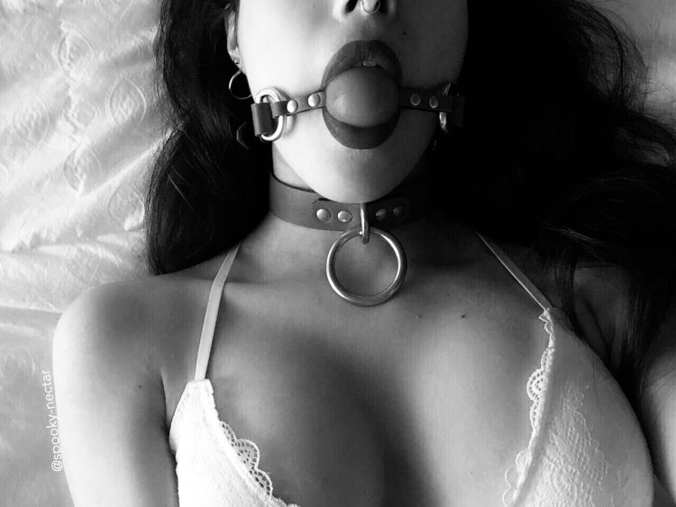 Girl in the collar and gag BDSM