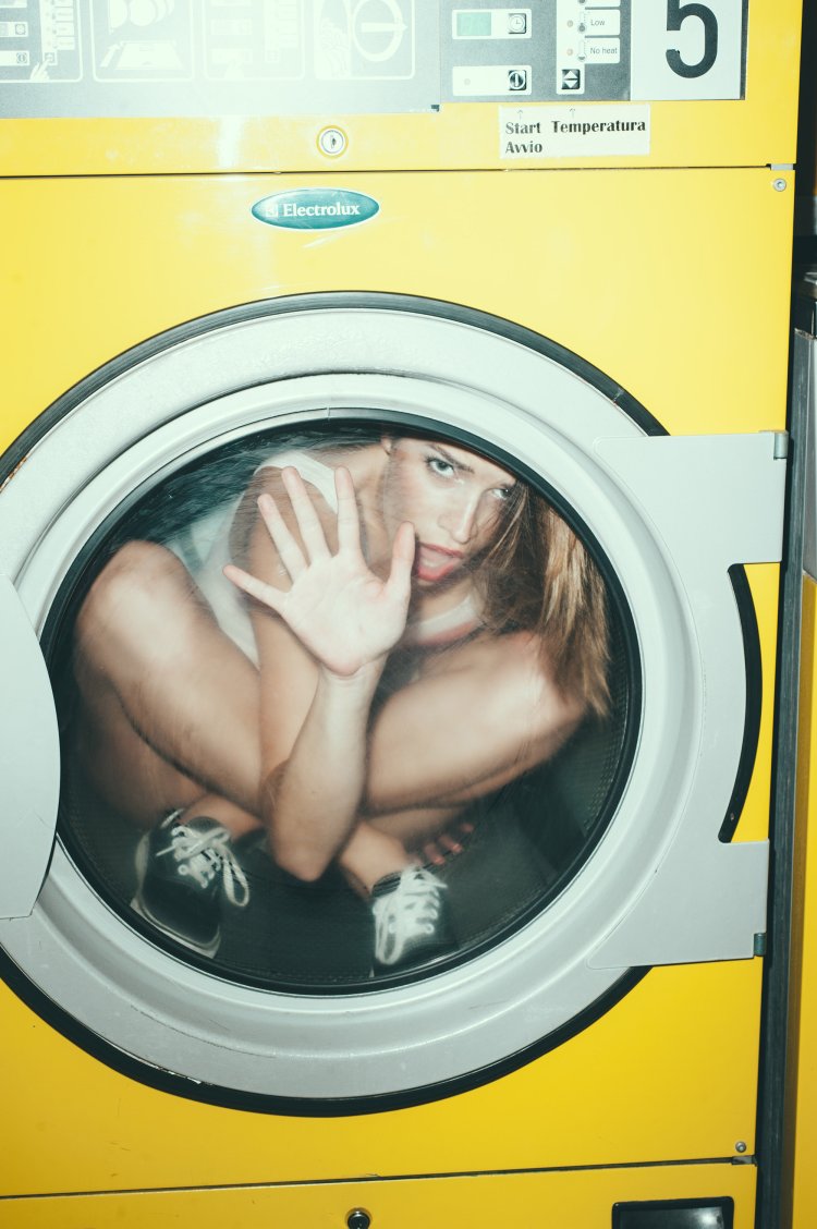 Naked on a washing machine