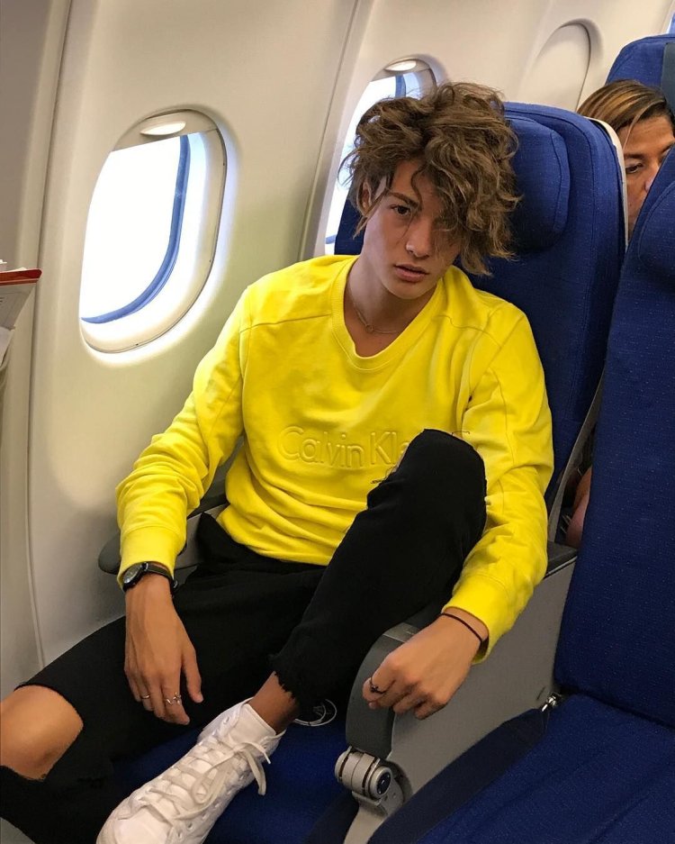 Jared Celma in a boat