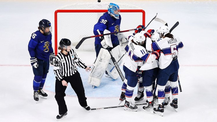 Women's team of Finland with puck hockey